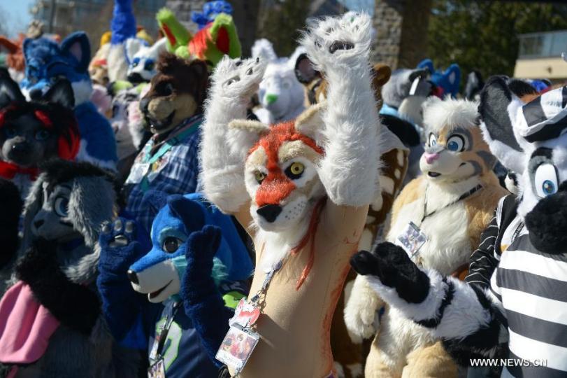 People wear their favorite furry costumes to take part in the 4th annual Anthromorphic Art and Costuming Convention on March.7, 2015 in Vancouver, Canada. (Xinhua/Sergei Bachlakov)